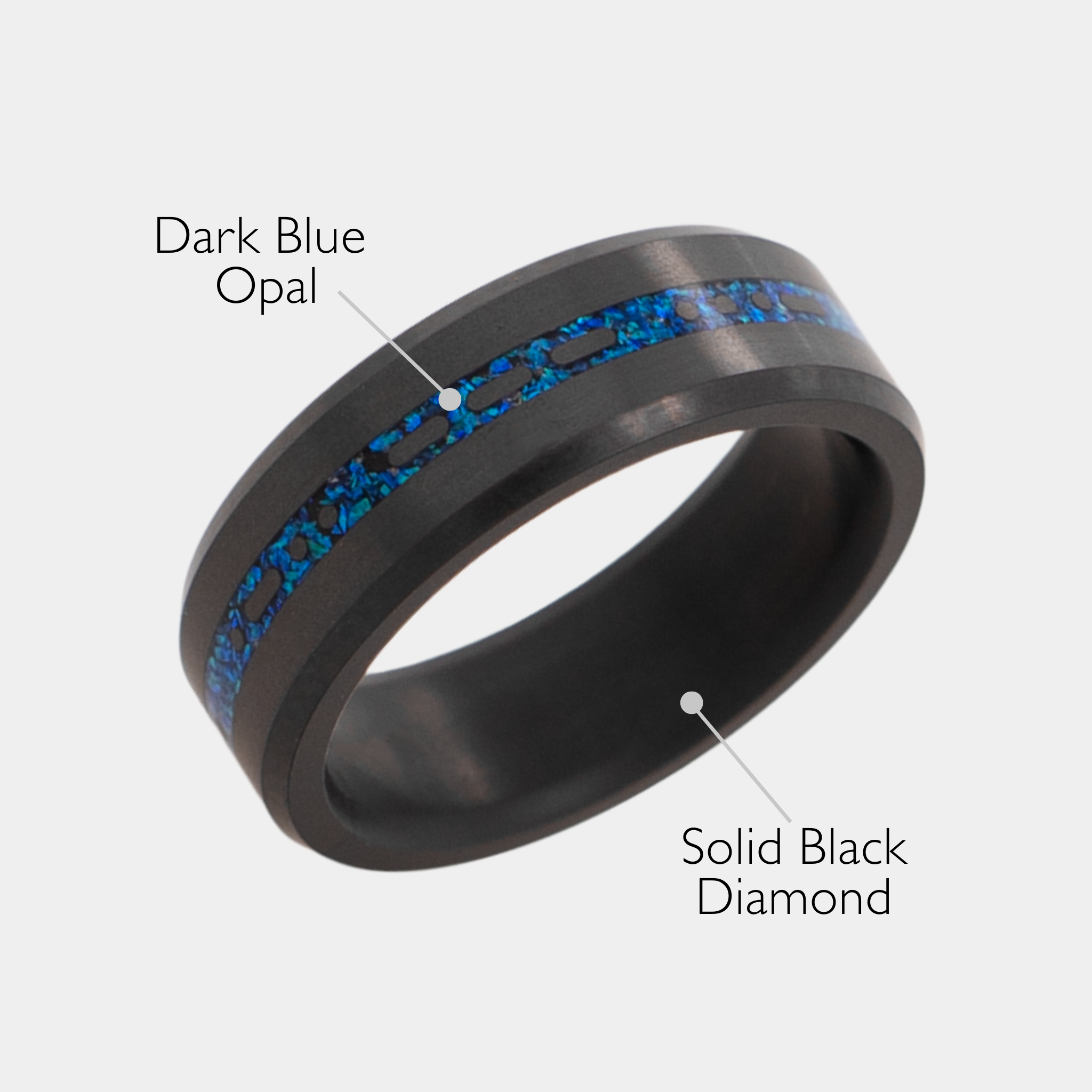 Solid Black Diamond ring with a laser engraved inlay reading "I love you" in morse code, filled with dark blue opal on a grey background.