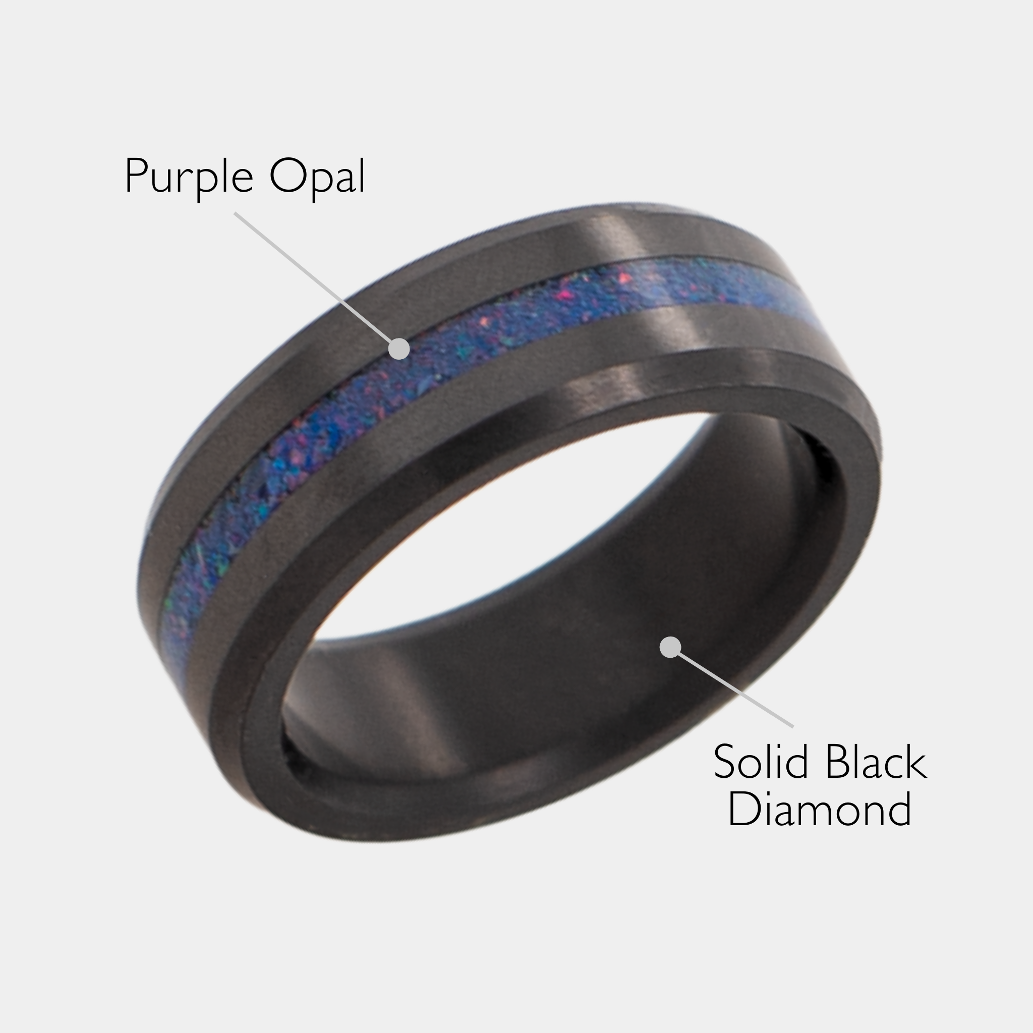 Solid Black Diamond ring with purple opal inlay on a grey background