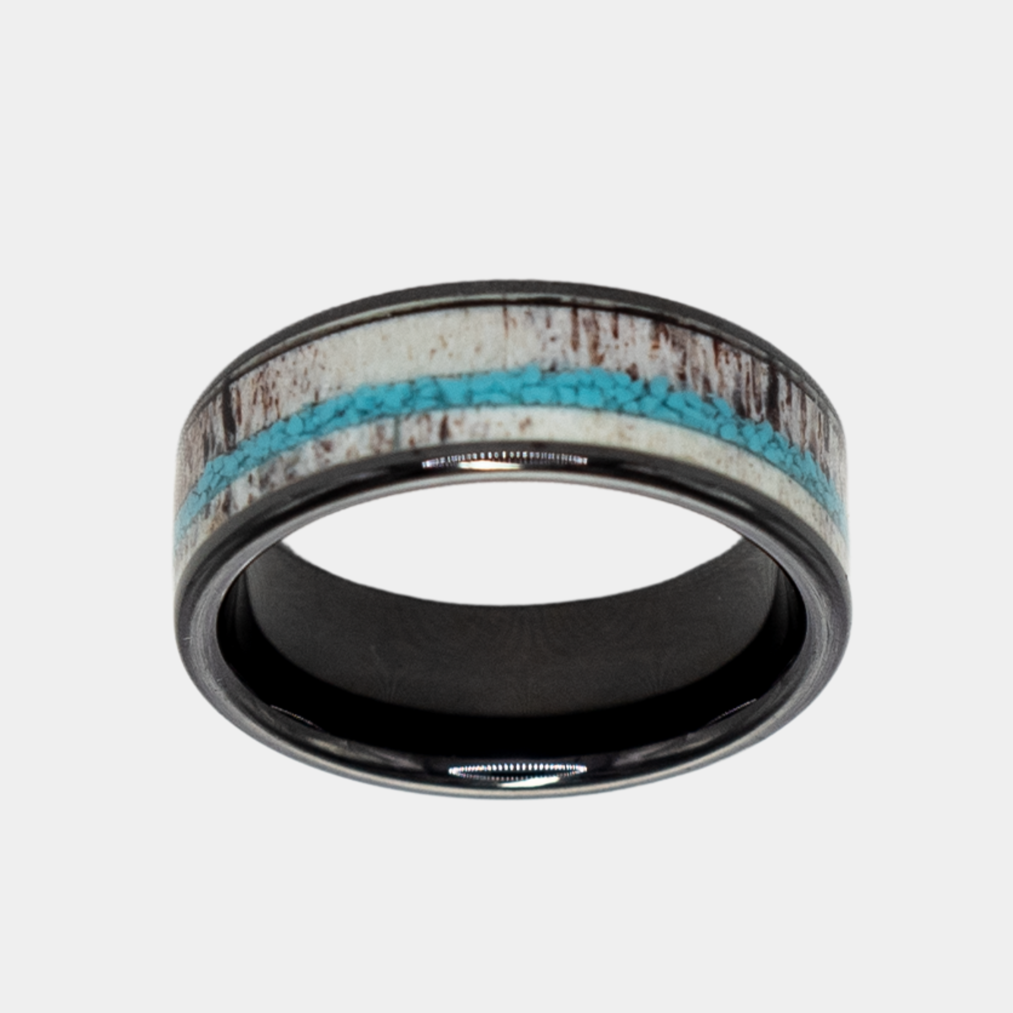 Hermes ring – Polished Black Ceramic with Turquoise and Deer Antler Inlays from the Hustler Collection. Top-down view showcasing ring face.