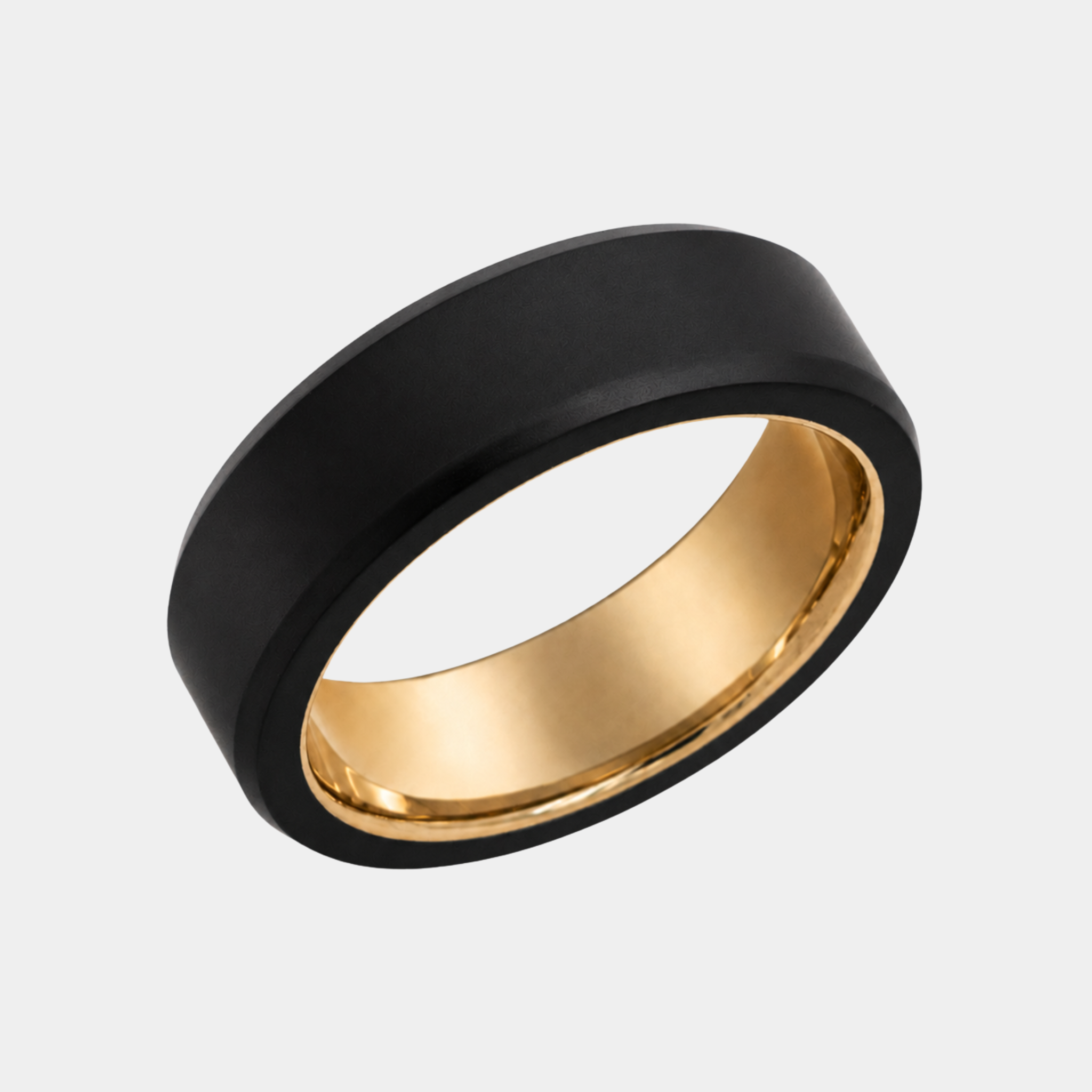 ARES 7mm polished solid black diamond wedding band with a yellow gold sleeve in a three-quarter studio view