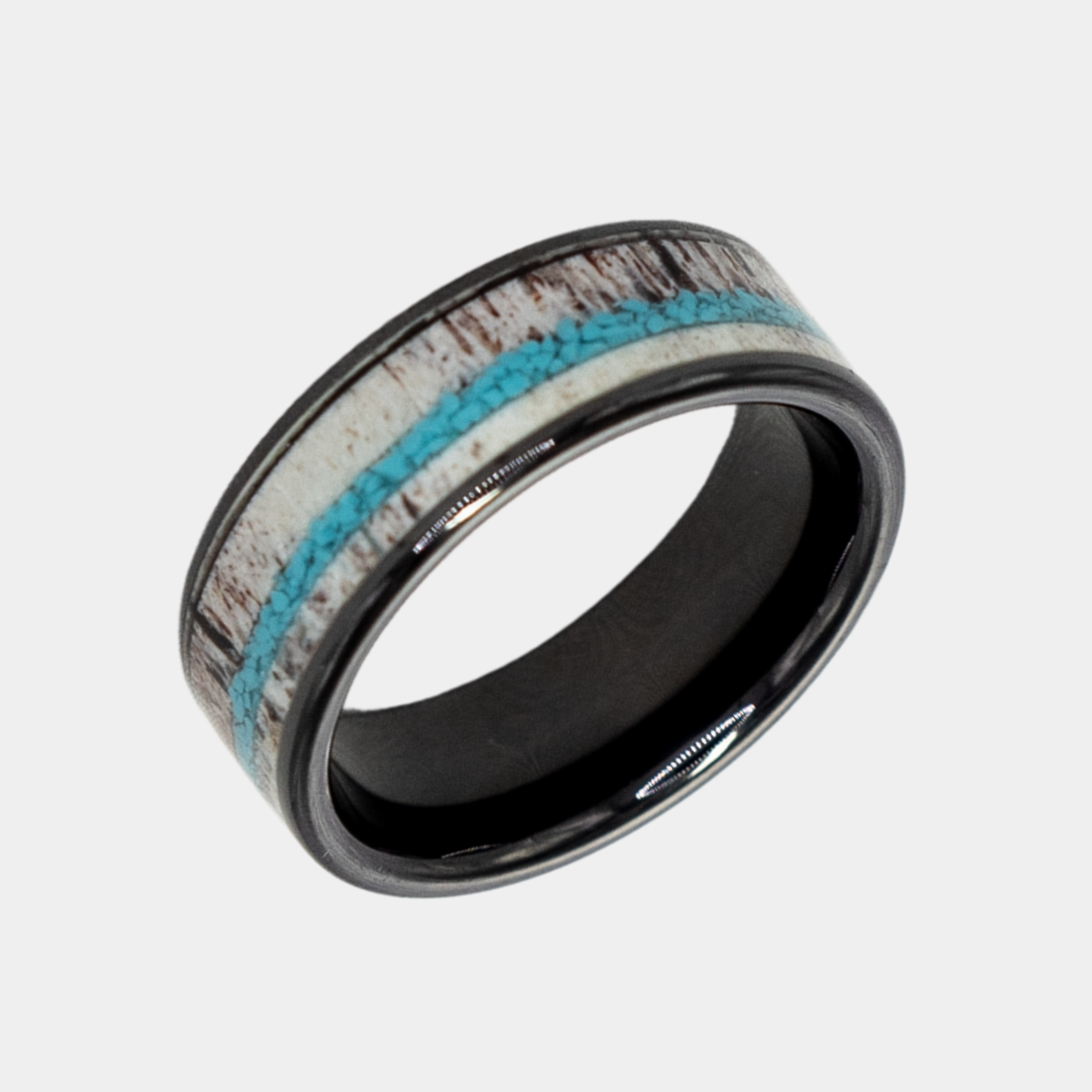 Hermes ring – solid black diamond with polished beveled edges from the Hustler Collection. Angled view highlighting shape and finish.