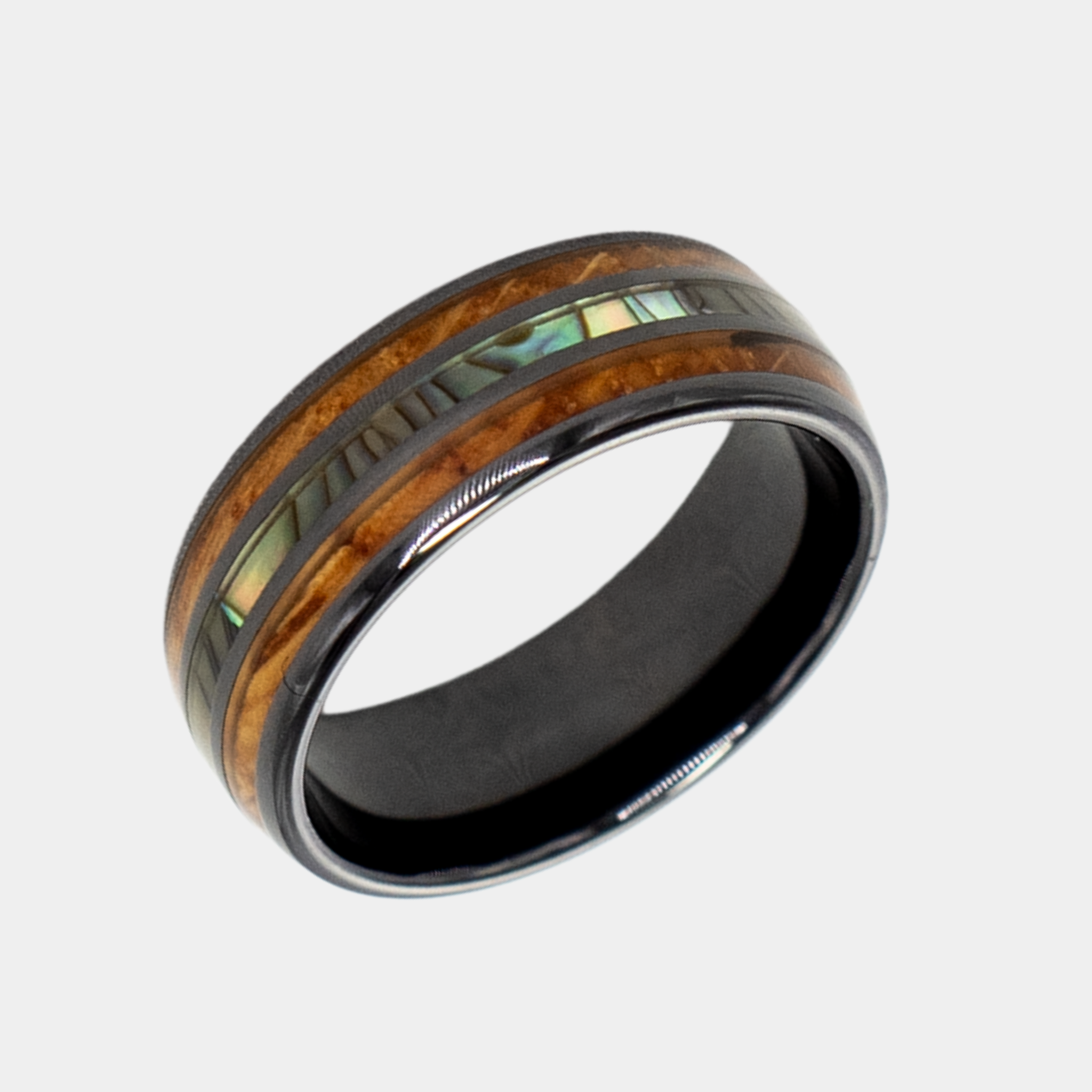 Odysseus ring – solid black diamond with polished beveled edges from the Hustler Collection. Angled view highlighting shape and finish.