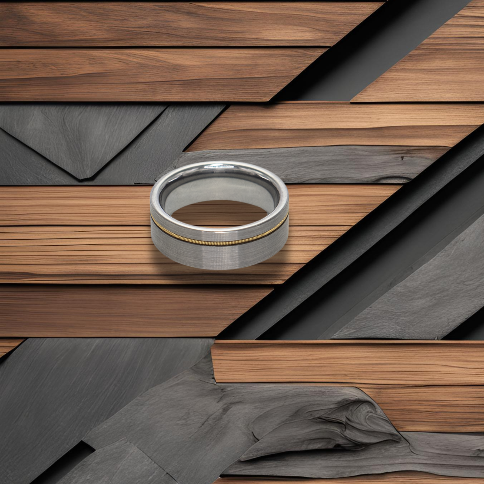 Orpheus ring – solid black diamond with polished beveled edges from the Hustler Collection. Lifestyle shot, placed on textured wood.