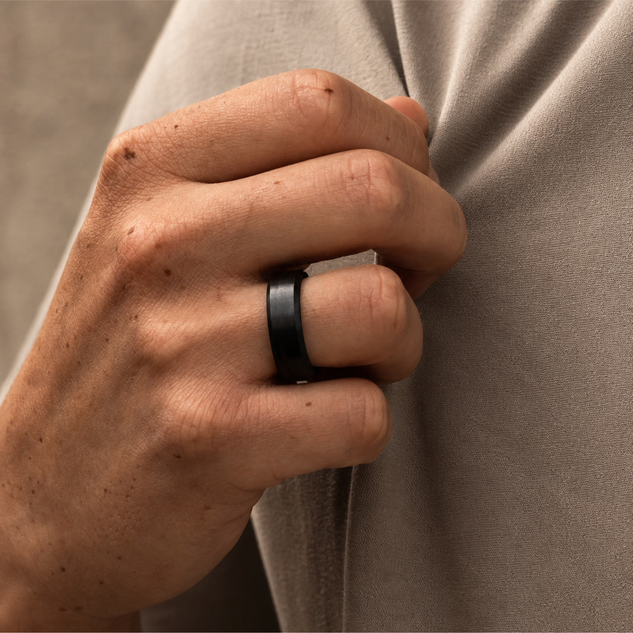ARES solid black diamond wedding band in 7mm polished finish, worn on hand to show its balanced width