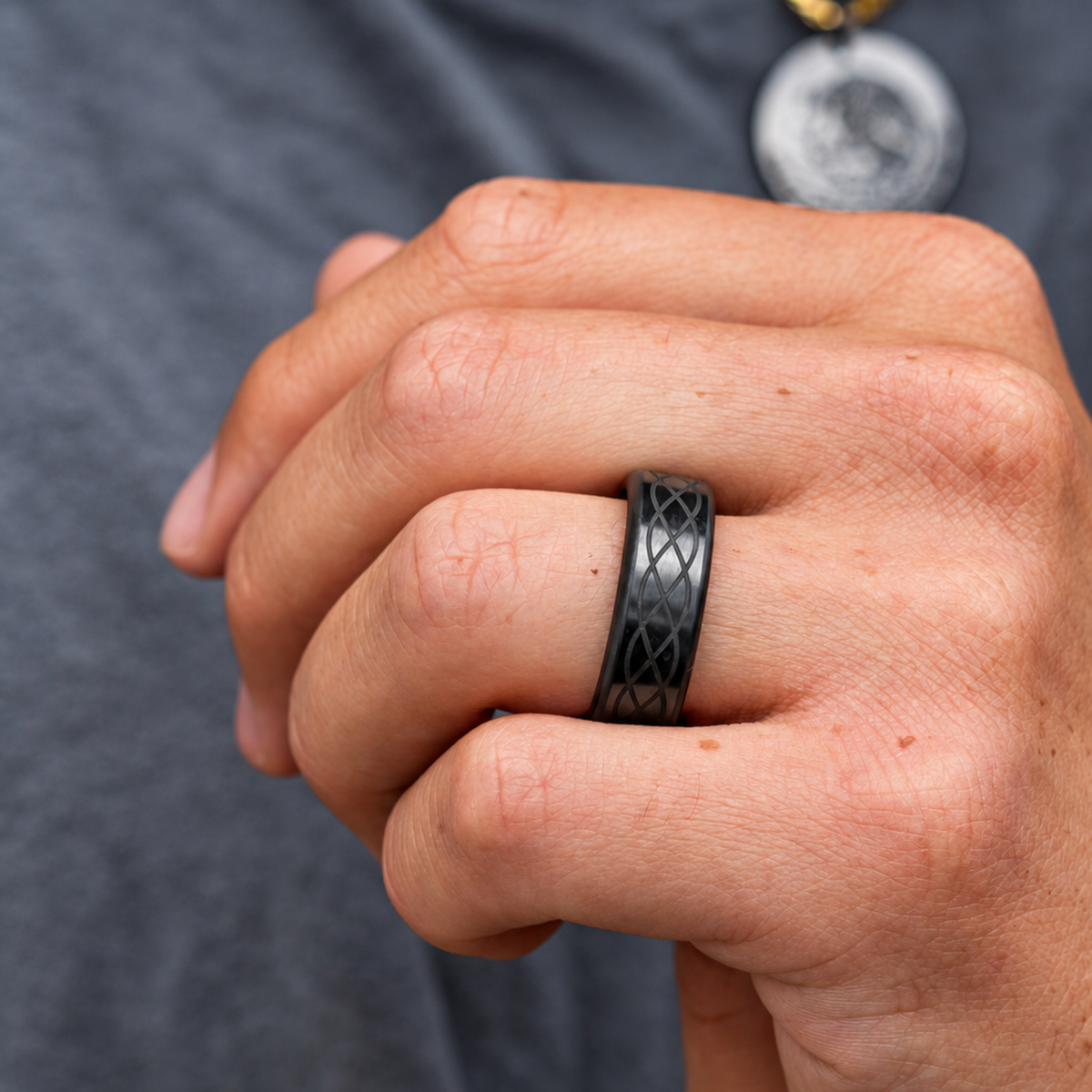 ARES solid black diamond ring worn on a hand, showing an example interwoven exterior laser design.